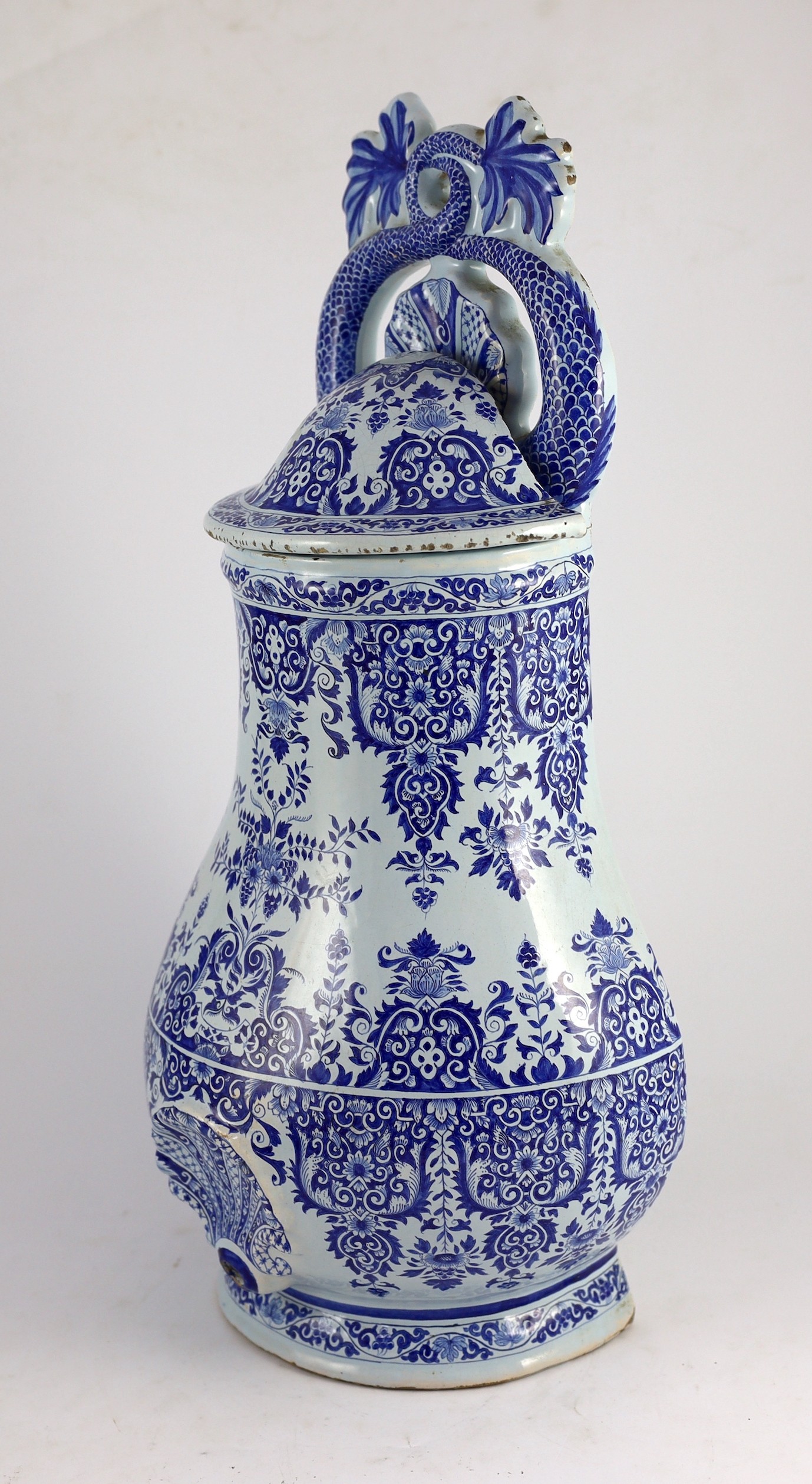 A large Rouen faience blue and white cistern, second quarter 18th century, 57.5cm high, restorations